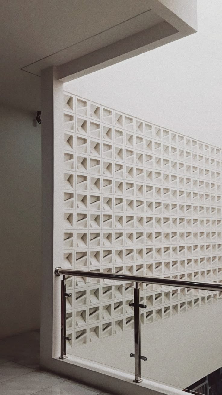 The implementation of minimalist $breeze$ $block$ on the facade of modern house architecture provides optimal ventilation and creates an aesthetically pleasing decorative roster.