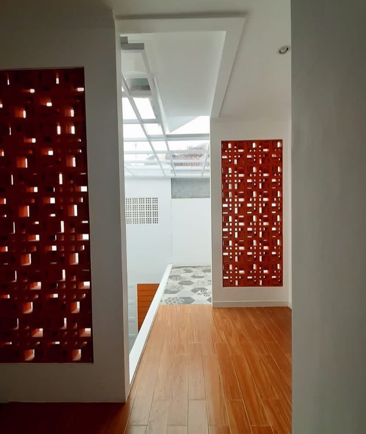 The implementation of minimalist $breeze$ $block$ on the facade of modern house architecture provides optimal ventilation and creates an aesthetically pleasing decorative roster.