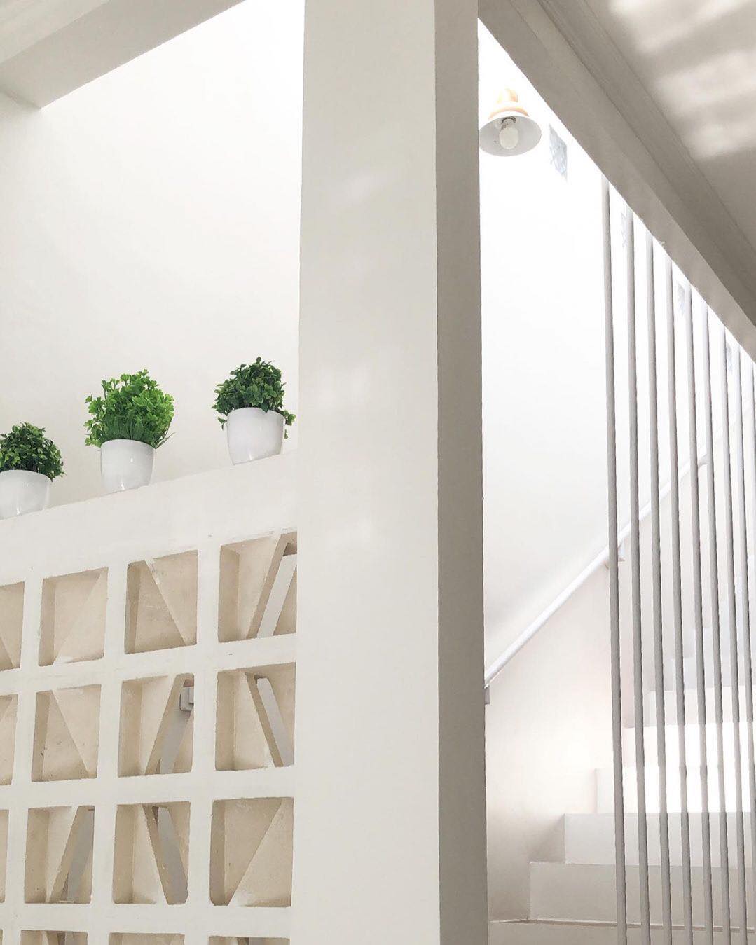 The implementation of minimalist $breeze$ $block$ on the facade of modern house architecture provides optimal ventilation and creates an aesthetically pleasing decorative roster.