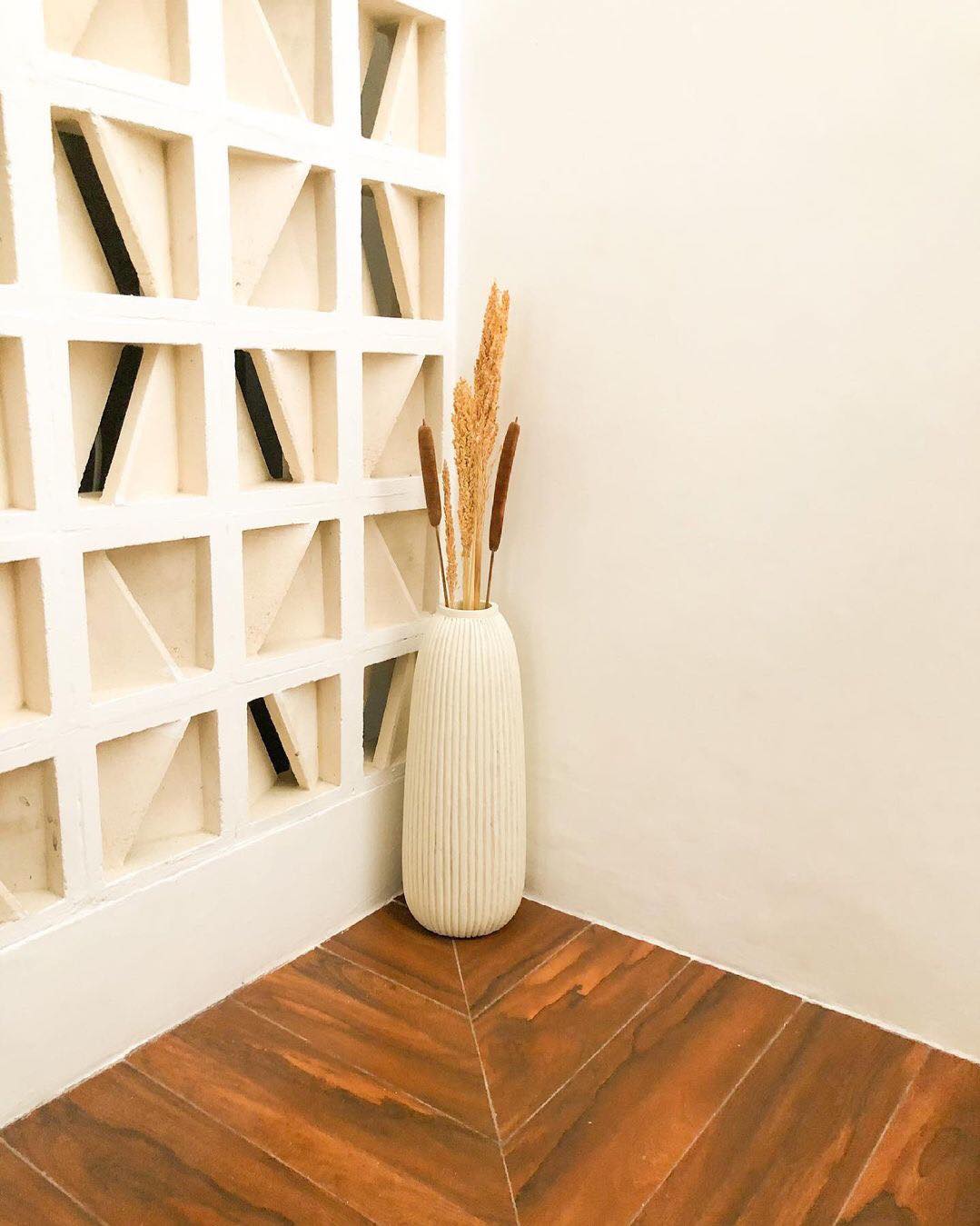 The implementation of minimalist $breeze$ $block$ on the facade of modern house architecture provides optimal ventilation and creates an aesthetically pleasing decorative roster.