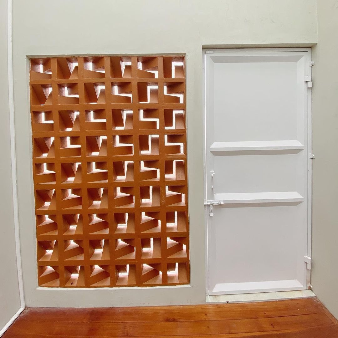 The implementation of minimalist $breeze$ $block$ on the facade of modern house architecture provides optimal ventilation and creates an aesthetically pleasing decorative roster.