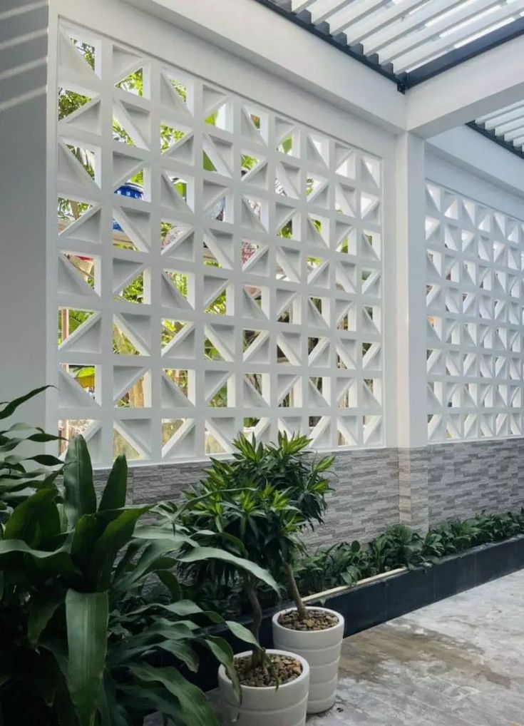 The implementation of minimalist $breeze$ $block$ on the facade of modern house architecture provides optimal ventilation and creates an aesthetically pleasing decorative roster.