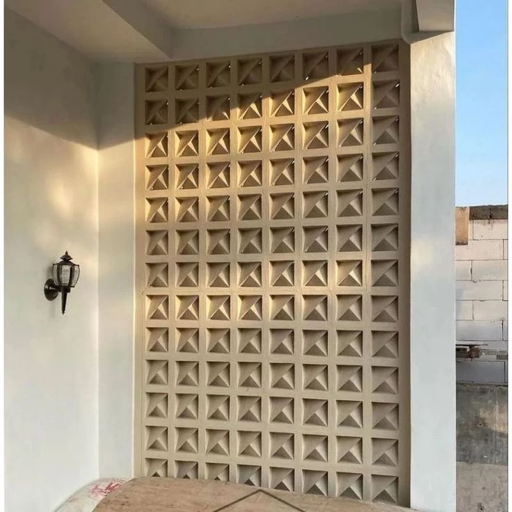 The implementation of minimalist $breeze$ $block$ on the facade of modern house architecture provides optimal ventilation and creates an aesthetically pleasing decorative roster.