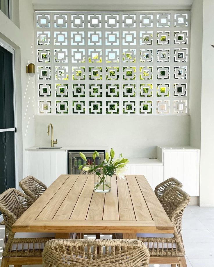 The implementation of minimalist $breeze$ $block$ on the facade of modern house architecture provides optimal ventilation and creates an aesthetically pleasing decorative roster.