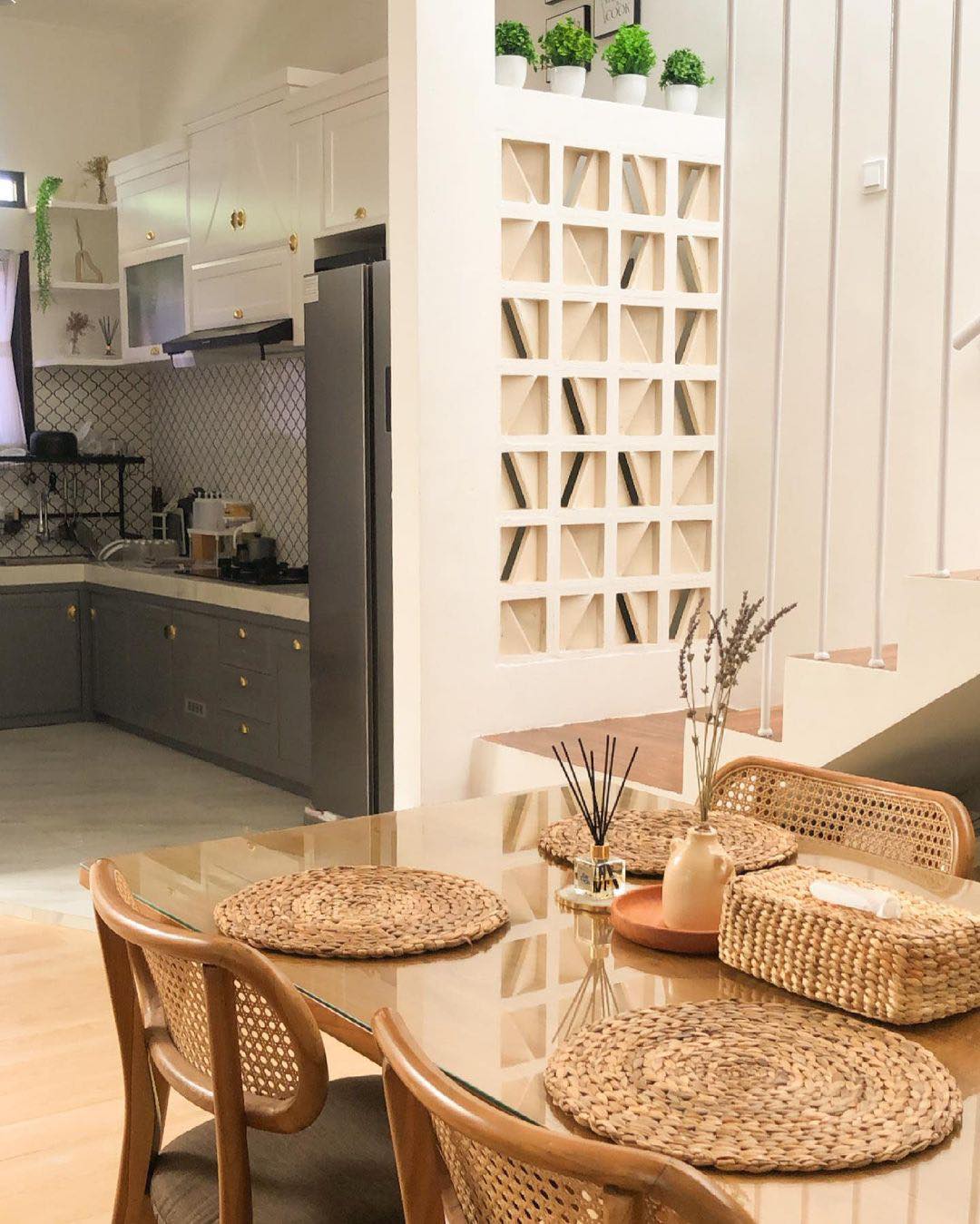 The implementation of minimalist $breeze$ $block$ on the facade of modern house architecture provides optimal ventilation and creates an aesthetically pleasing decorative roster.