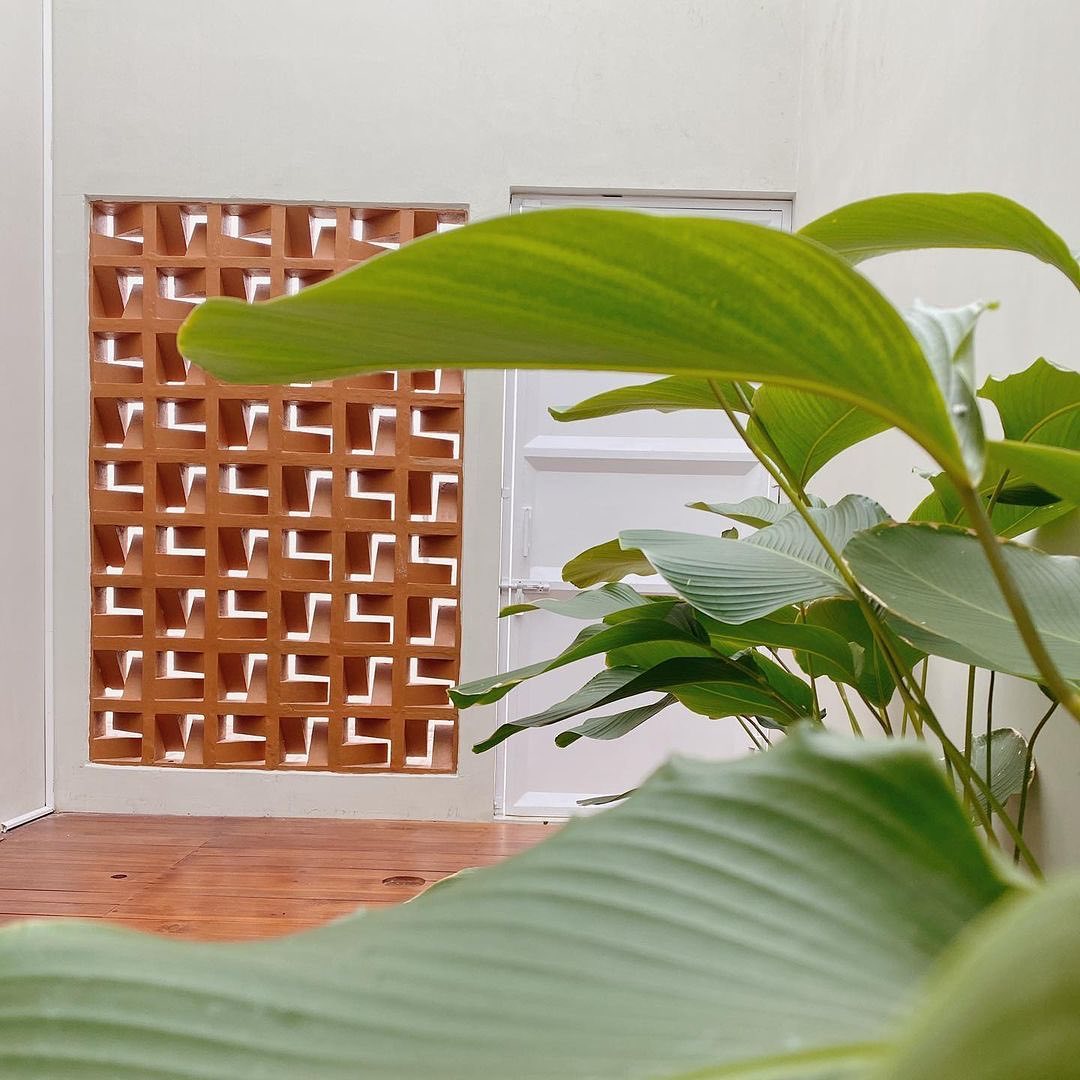 The implementation of minimalist $breeze$ $block$ on the facade of modern house architecture provides optimal ventilation and creates an aesthetically pleasing decorative roster.