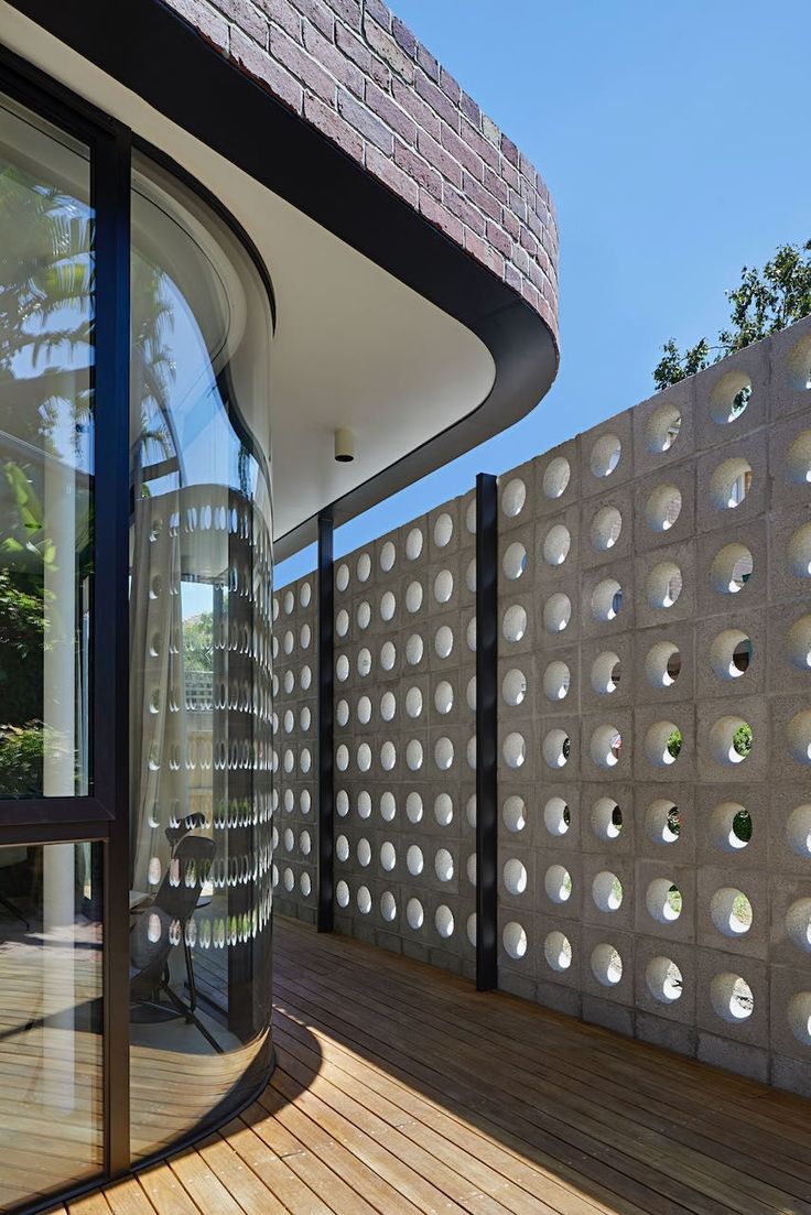 The implementation of minimalist $breeze$ $block$ on the facade of modern house architecture provides optimal ventilation and creates an aesthetically pleasing decorative roster.