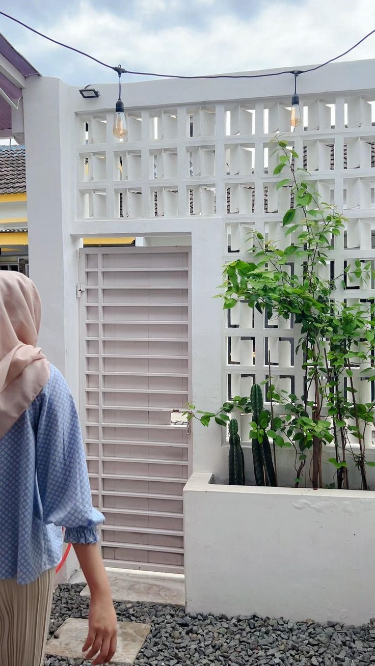 The implementation of minimalist $breeze$ $block$ on the facade of modern house architecture provides optimal ventilation and creates an aesthetically pleasing decorative roster.