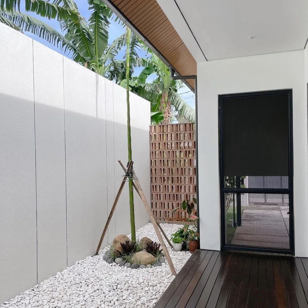 The implementation of minimalist $breeze$ $block$ on the facade of modern house architecture provides optimal ventilation and creates an aesthetically pleasing decorative roster.