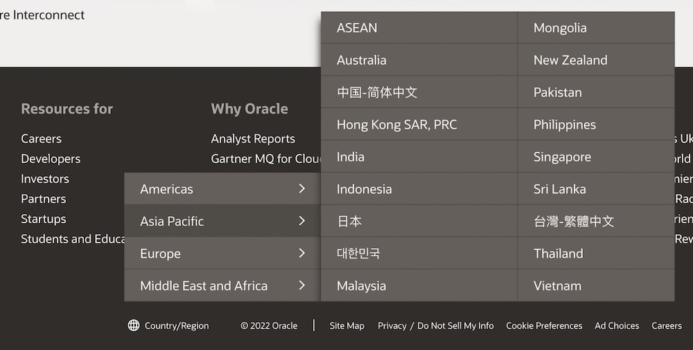 Oracle with a vertical-split menu for the country/region selection in its footer.