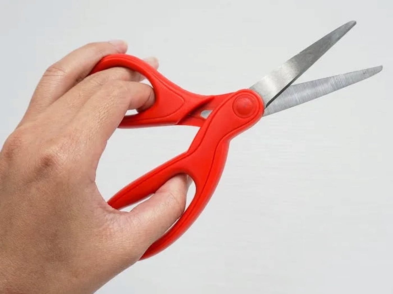 The difficulty of using physical devices designed for right-handed use.
