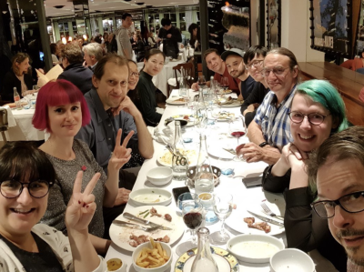 The Samsung group posing for an after-dinner picture around the table