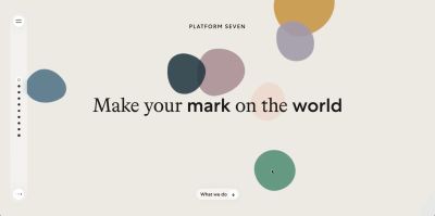 A landing page that says Make Your mark On The World and colored blobs scattered on the page