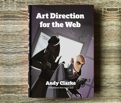 A hardcover book laying on a wooden floor, called “Art Direction for the Web”