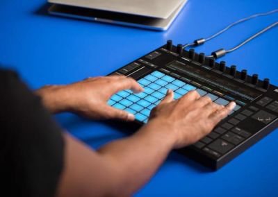 Man touching Ableton Push device