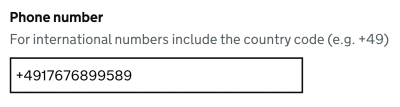 A field to fill out in a form asking for a phone number including the country code