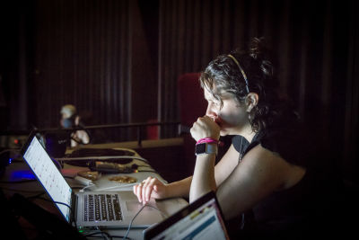 A photo of Amanda at a desk at the conference