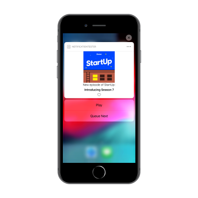 iPhone 8 Plus with custom notification loaded with an options to Play or Add to Queue.