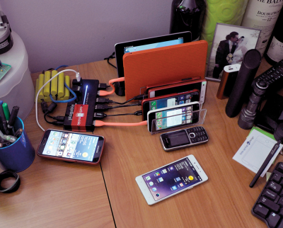 A picture taken by the author himself showing the devices he uses and switched between them regularly at home