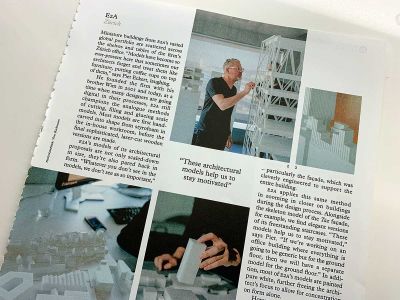 A photograph of a magazine article with text, quotes and images in boxes