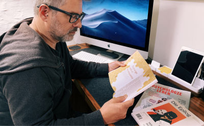 Andy Clarke reading Pressing Matters magazine