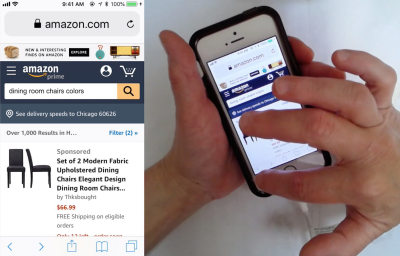 A product page on Amazon.com of dining room chairs shown on a mobile device with a person holding it with their left hand and using their right index finger to press on the Back button