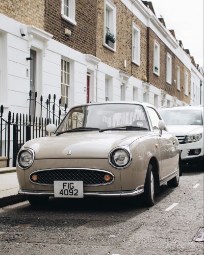 A picture of a car that looks like it has facial parts such as eyes and a mouth (front)