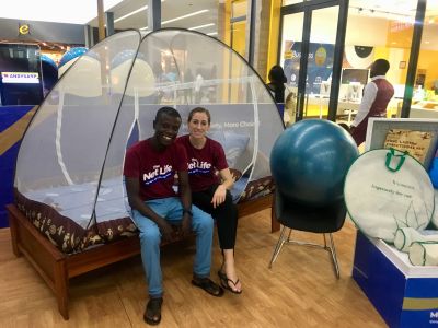 A bed with a mosquito net on which two people sit was created using design thinking