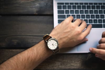 'Man in a watch typing' by Brad Neathery on Unsplash