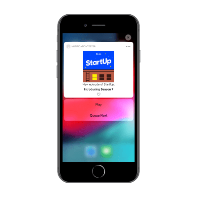 iPhone 8 Plus with custom notification loaded with an options to Play or Add to Queue.