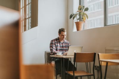 A web developer working on his laptop