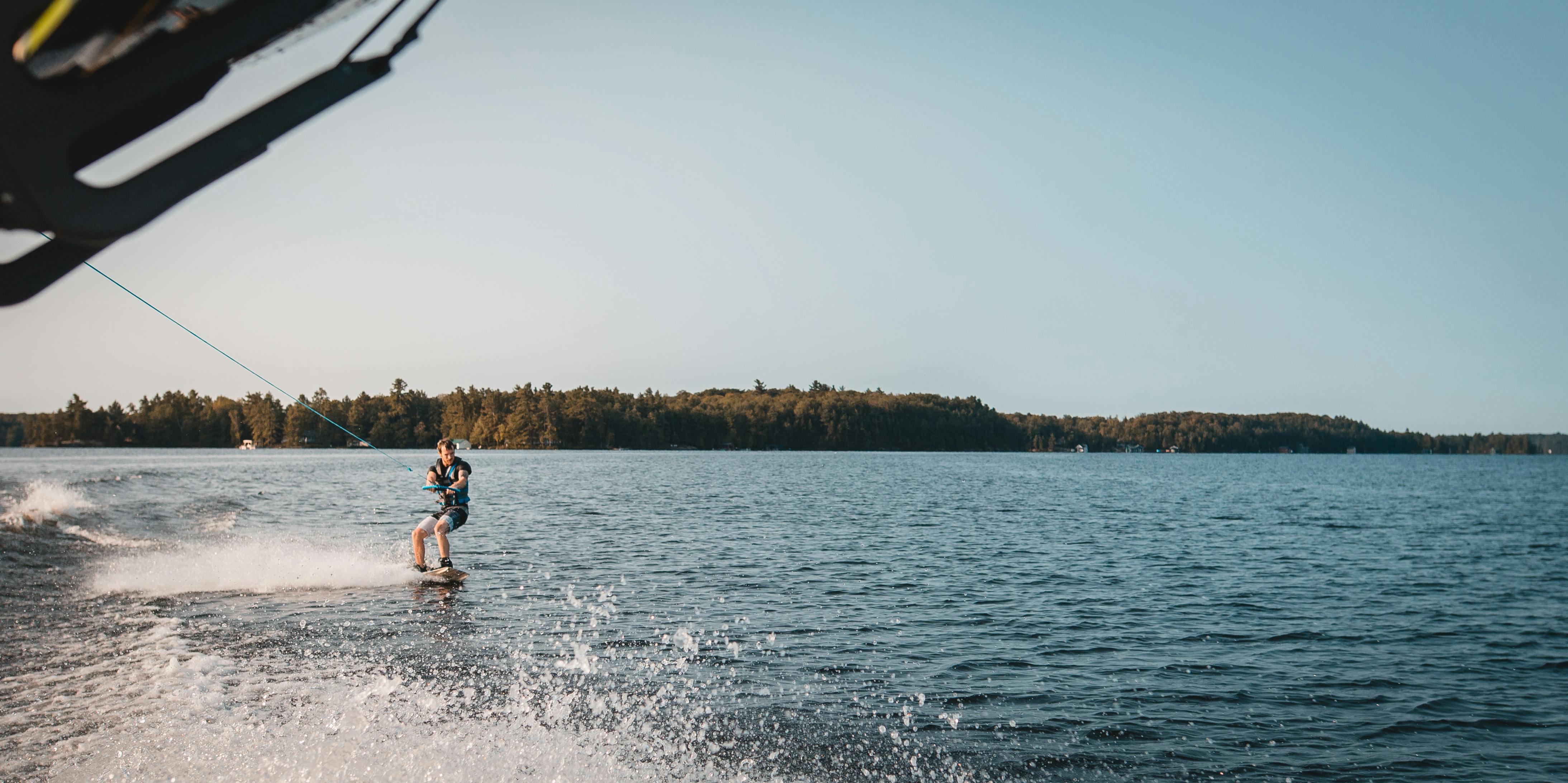 Free Man Holding Parachute With Wakeboard Stock Photo