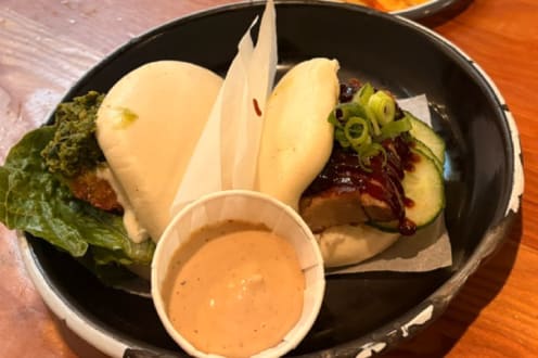 Bao buns with a dipping sauce at one of the food stops