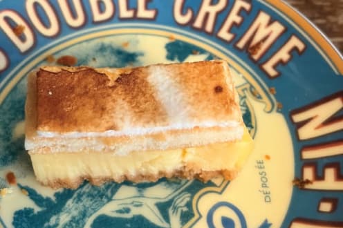 A slice of dessert on a vintage Double Creme plate