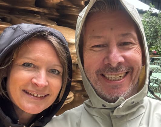 Vicki and Shaun in their rain hoods on the Soho food hunt
