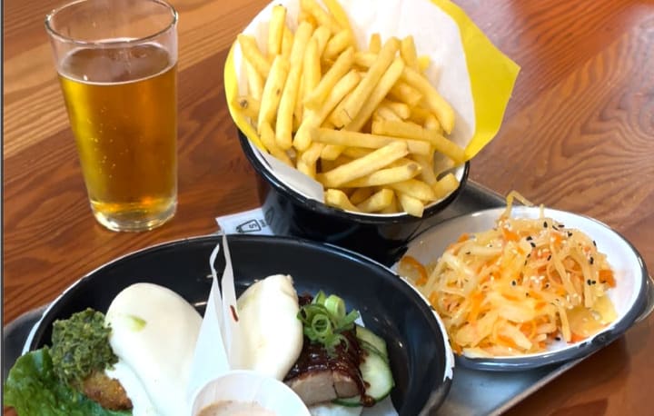 Bao buns, fries, slaw and a pint at one of the food stops