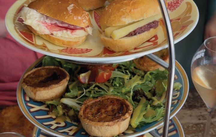 Brioche buns and mini quiches on the three-tier cake stand