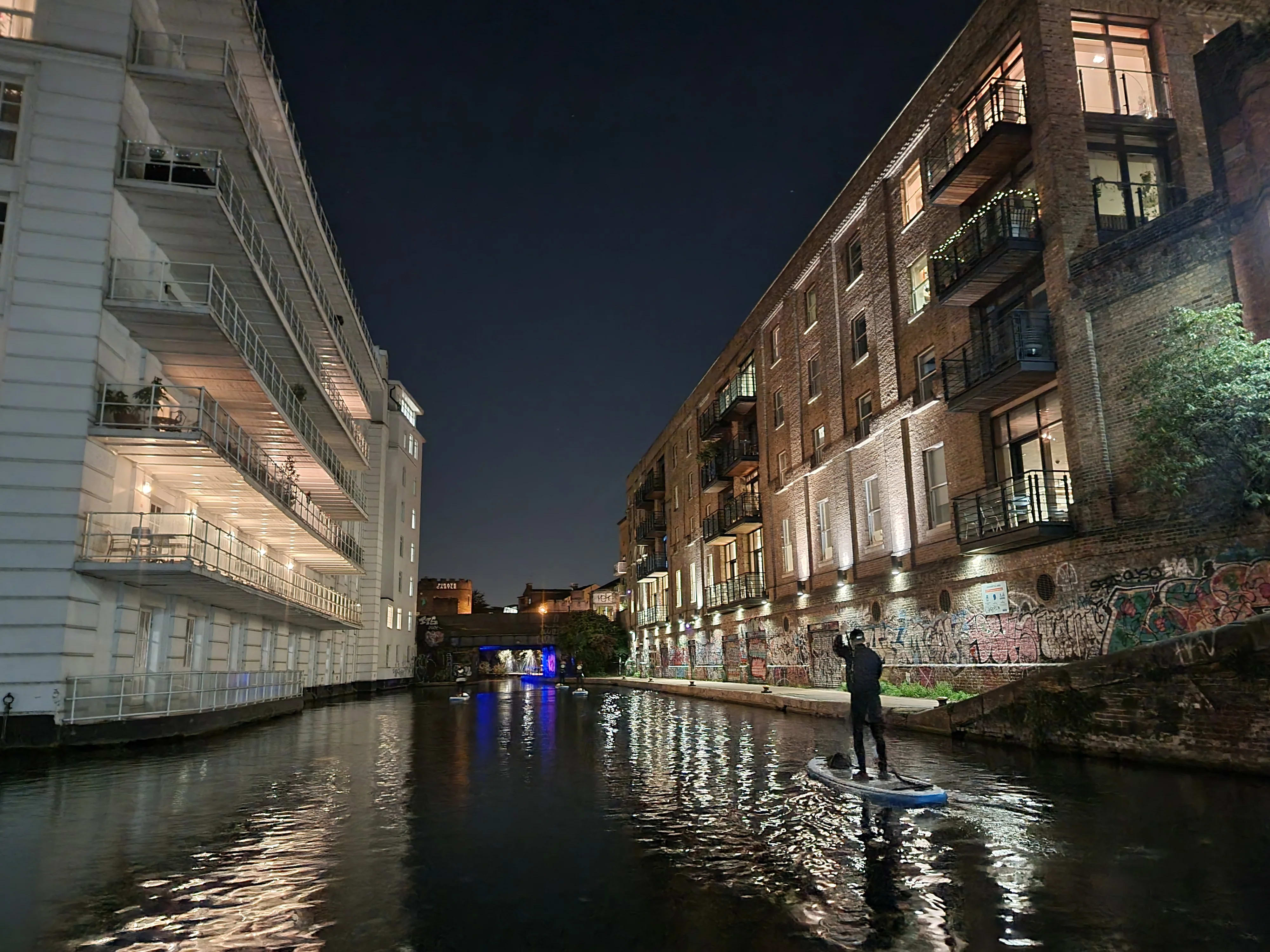 Paddle boarding by full moon