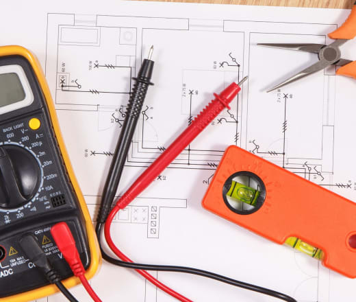 Electrical engineering diagrams and multimeter