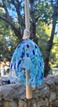 blown glass wind chime with wood clapper