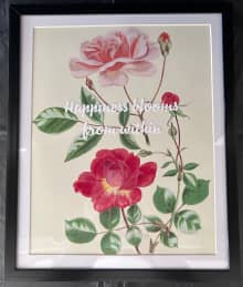framed image of roses in pink and red with inspirational quote