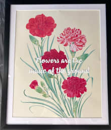 framed image of pink, red, and variegated red and white carnations with inspirational quote