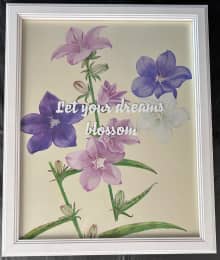 framed image of pink and purple wildflowers with inspirational quote