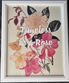 framed image of multiple roses in shades of pink and peach with inspirational quote