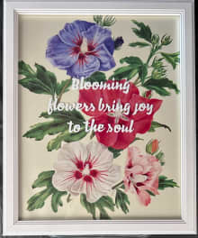 framed image of hibiscus flowers in pink, white, red, and purple with inspirational quote