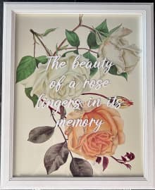framed image of three roses in shades of off white and peach with inspirational quote