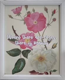 framed image of three roses with inspirational quote