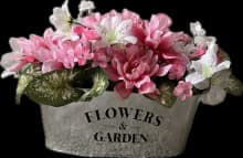 elegant pink floral arrangement with oval tin vase