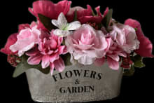 pink floral arrangement with oval tin vase