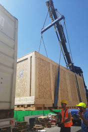 A newly constructed, ISPM 15 compliant custom wooden crate designed by Infinity Pack & Ship for heavy machinery.